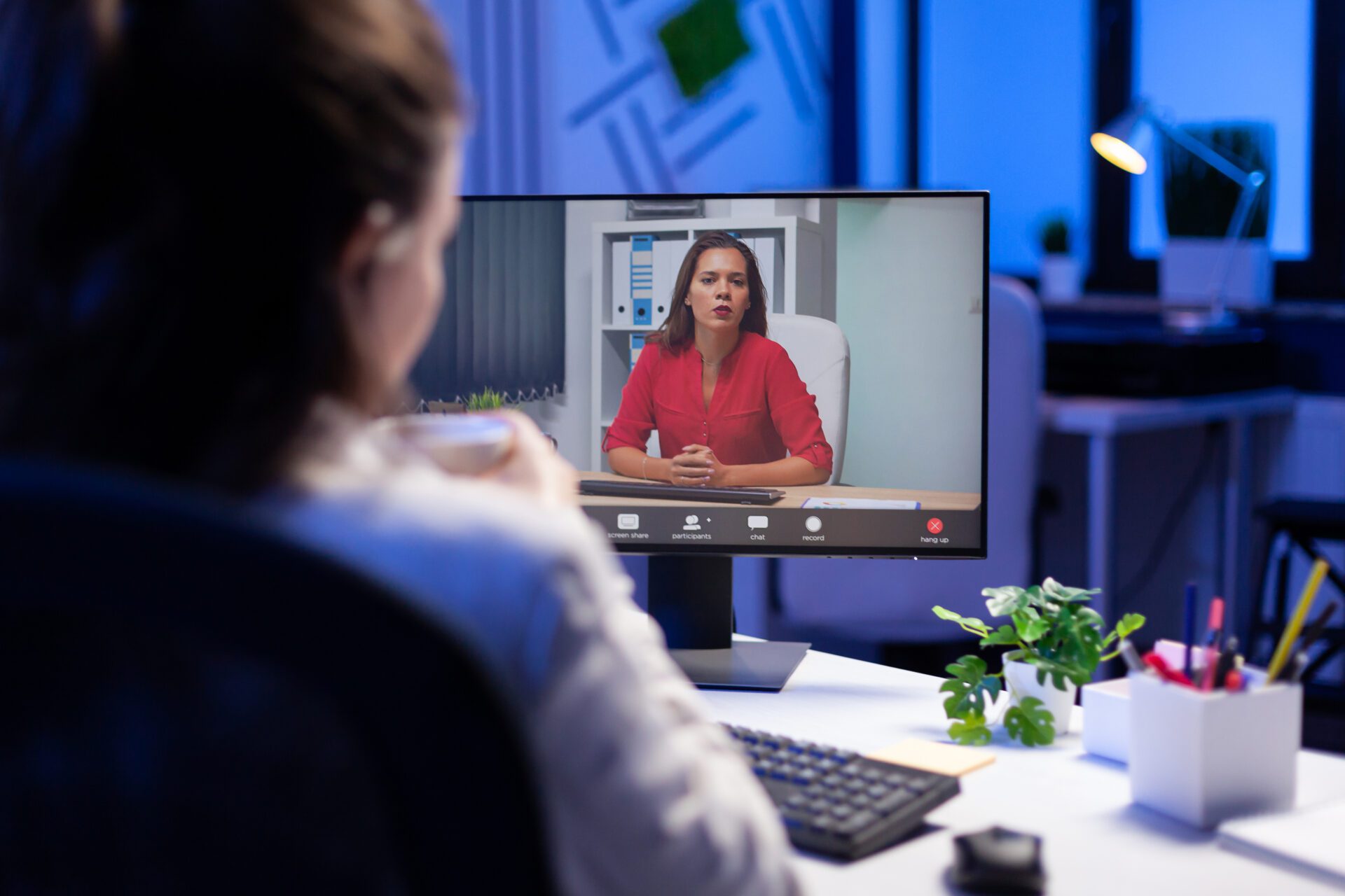 Manager talking with teamates during online teleconference